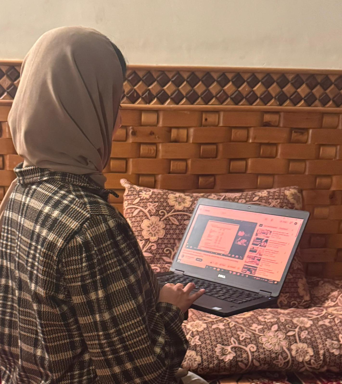 Student practicing coding on laptop